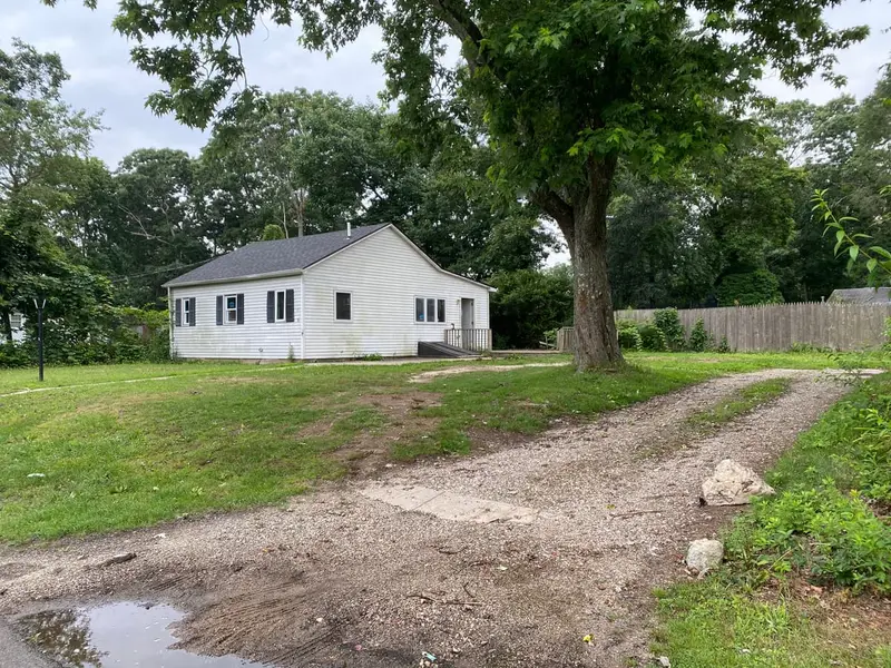 Small ranch set back behind a gravel driveway, Shirley, NY